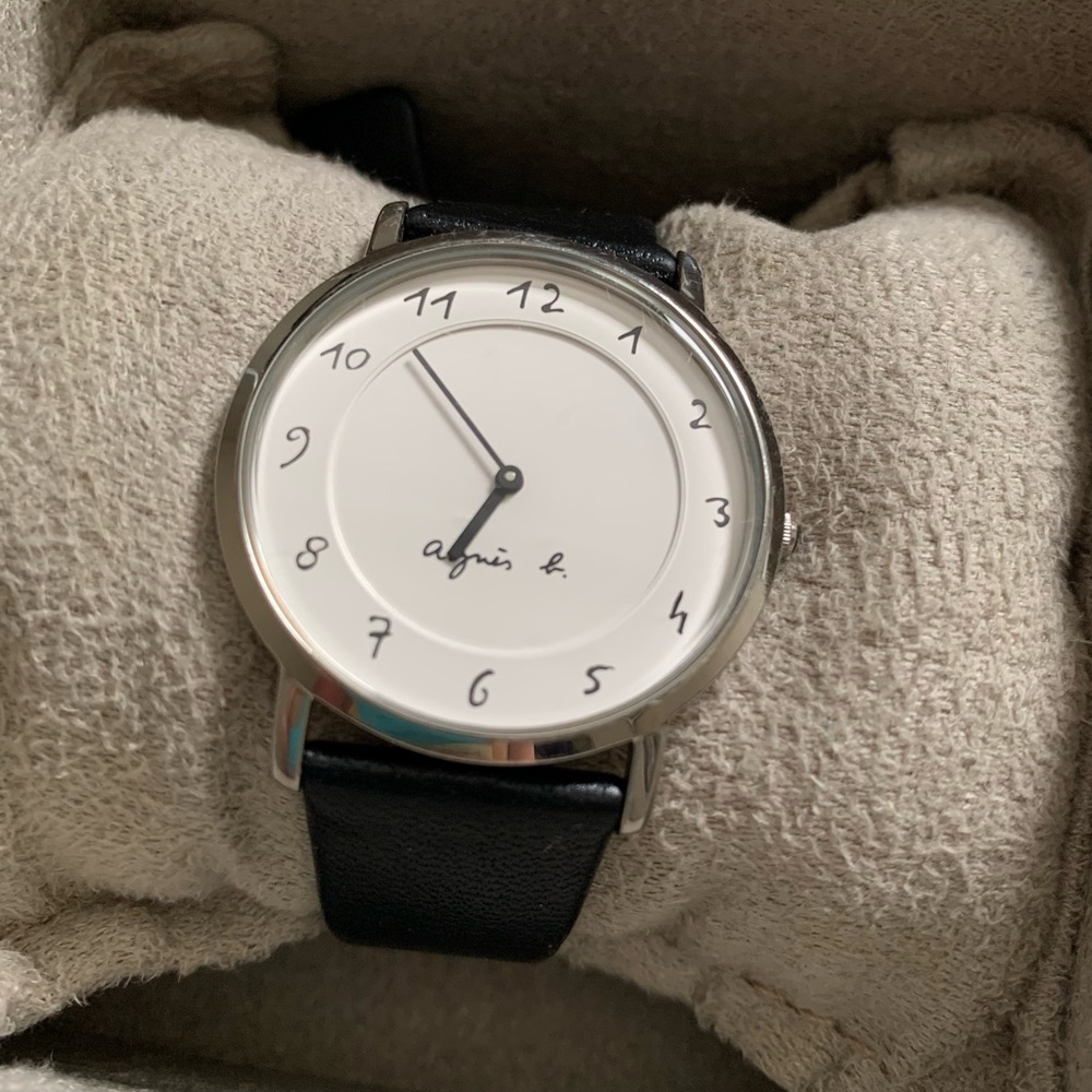Agnès b. Classic silver metal with black leather strap Wristwatch